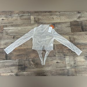 Off-White mesh long sleeve mock neck crop top with front tie and pearl details.